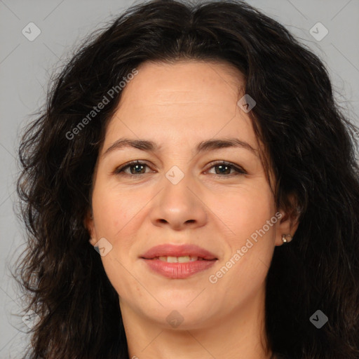 Joyful white adult female with long  brown hair and brown eyes