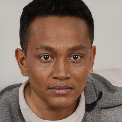 Neutral black young-adult male with short  brown hair and brown eyes