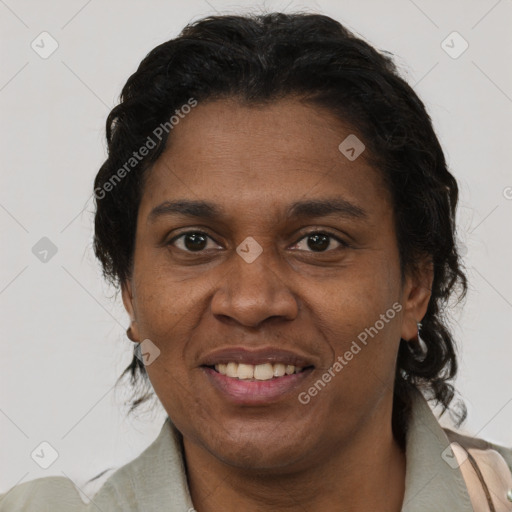 Joyful black adult female with short  brown hair and brown eyes