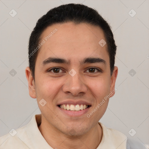 Joyful latino young-adult male with short  brown hair and brown eyes