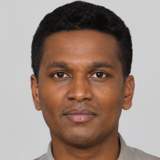 Neutral black young-adult male with short  black hair and brown eyes