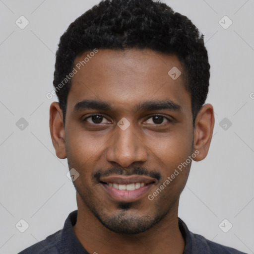 Joyful black young-adult male with short  black hair and brown eyes