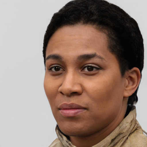 Joyful latino young-adult female with short  black hair and brown eyes