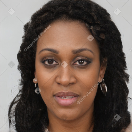 Joyful black young-adult female with long  brown hair and brown eyes