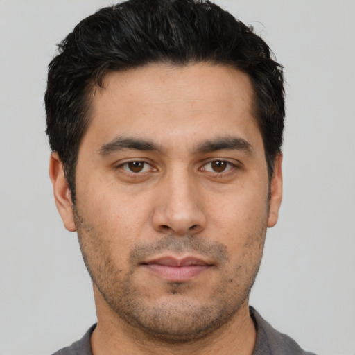 Neutral white young-adult male with short  black hair and brown eyes