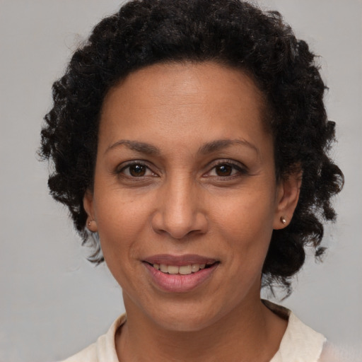 Joyful white adult female with short  brown hair and brown eyes