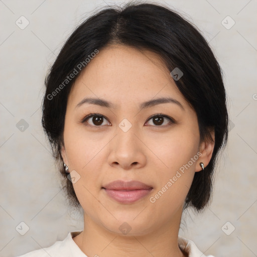 Joyful asian young-adult female with medium  brown hair and brown eyes