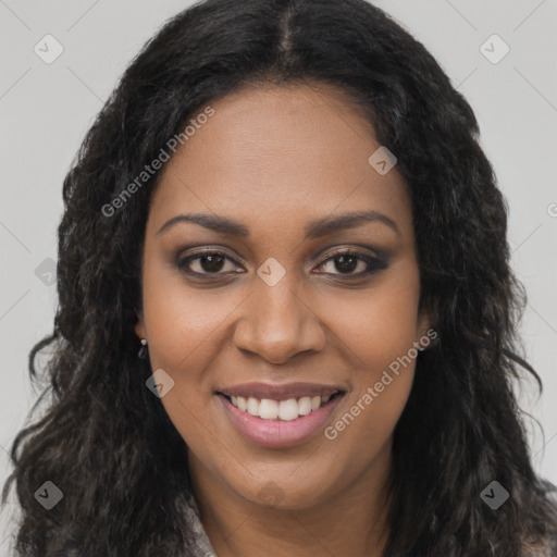 Joyful black young-adult female with long  brown hair and brown eyes