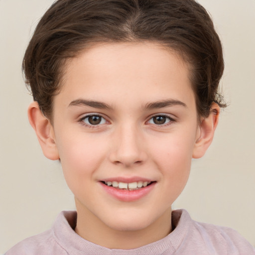 Joyful white child female with short  brown hair and brown eyes