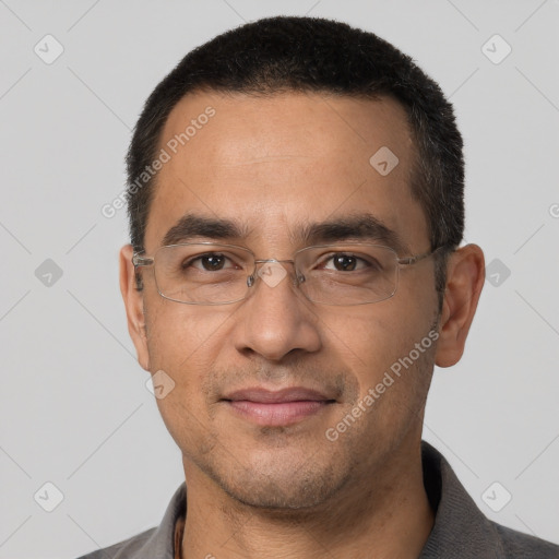 Joyful white adult male with short  black hair and brown eyes