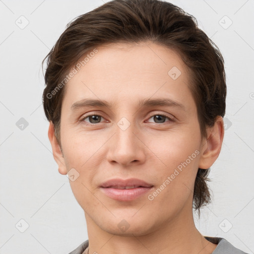 Joyful white young-adult female with short  brown hair and grey eyes