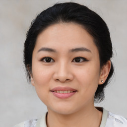 Joyful asian young-adult female with medium  black hair and brown eyes