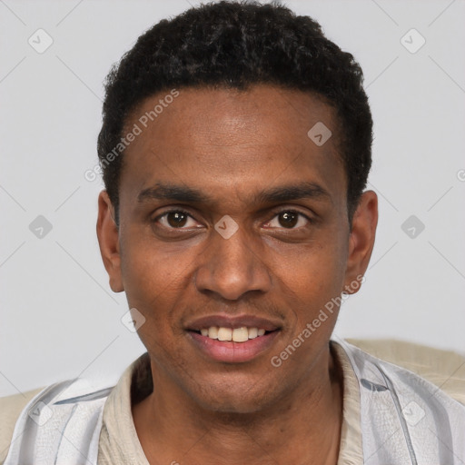 Joyful black young-adult male with short  black hair and brown eyes