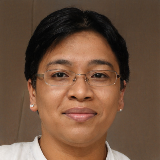 Joyful asian adult female with short  brown hair and brown eyes
