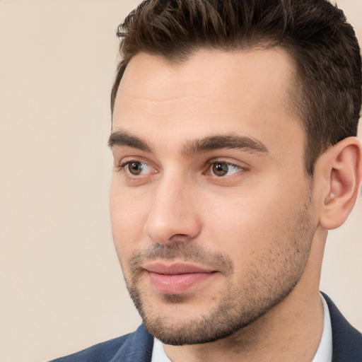 Joyful white young-adult male with short  brown hair and brown eyes