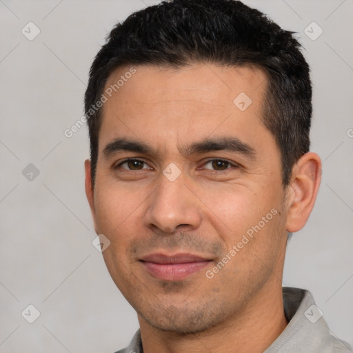 Joyful white young-adult male with short  black hair and brown eyes