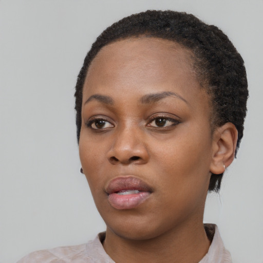 Neutral black young-adult female with short  black hair and brown eyes