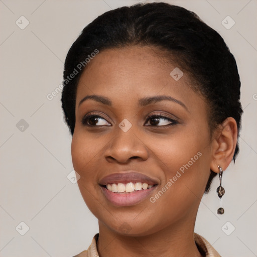 Joyful black young-adult female with medium  black hair and brown eyes