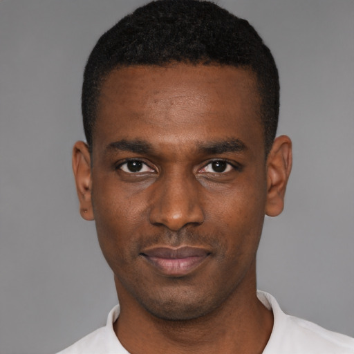 Neutral black young-adult male with short  black hair and brown eyes