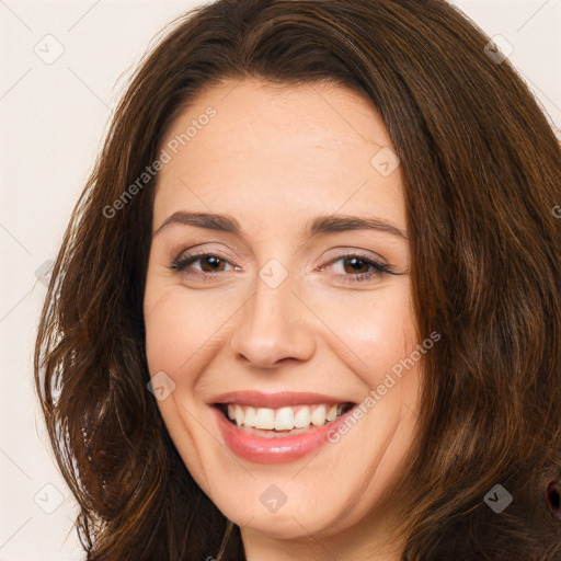 Joyful white adult female with long  brown hair and brown eyes