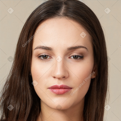 Neutral white young-adult female with long  brown hair and brown eyes