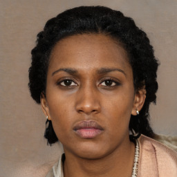 Neutral black young-adult female with short  black hair and brown eyes