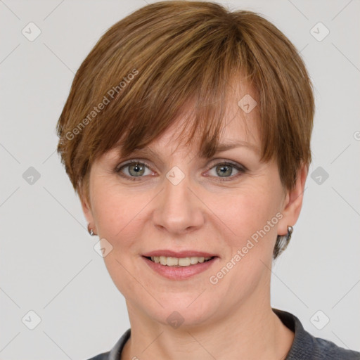 Joyful white adult female with short  brown hair and grey eyes