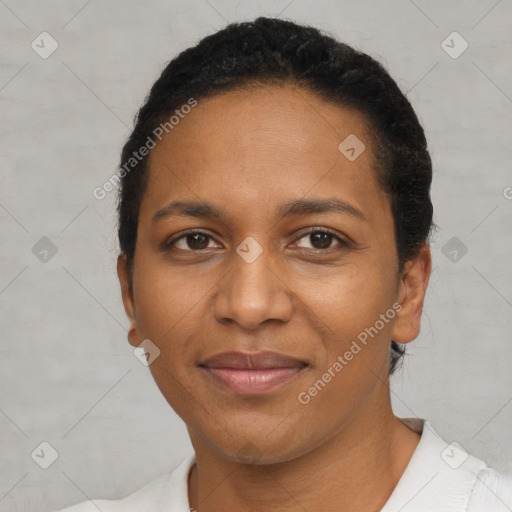 Joyful black adult female with short  brown hair and brown eyes