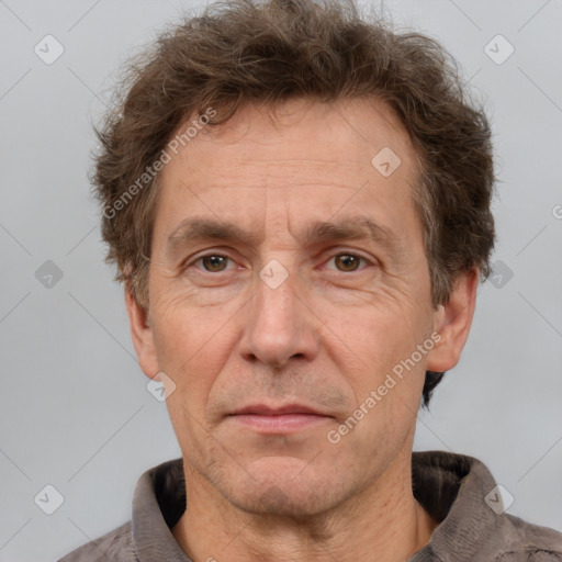 Joyful white middle-aged male with short  brown hair and brown eyes