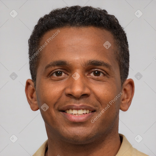 Joyful latino young-adult male with short  brown hair and brown eyes