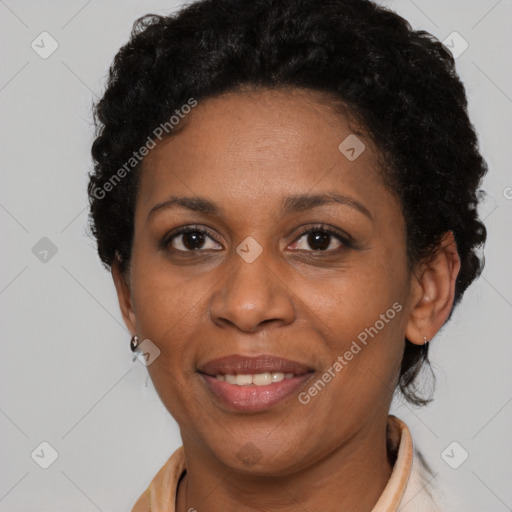 Joyful black adult female with short  brown hair and brown eyes