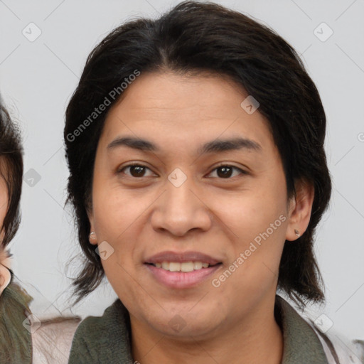 Joyful white adult female with medium  brown hair and brown eyes