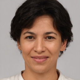 Joyful white adult female with short  brown hair and brown eyes