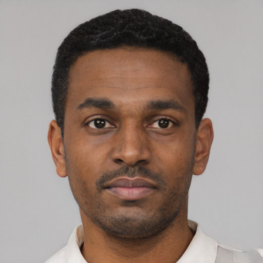 Neutral black young-adult male with short  black hair and brown eyes