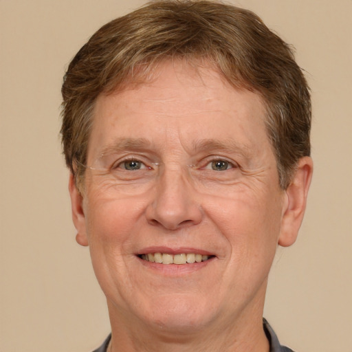 Joyful white middle-aged male with short  brown hair and grey eyes