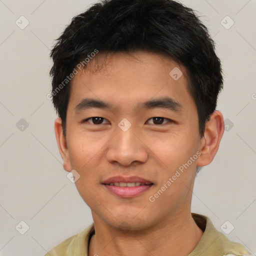 Joyful asian young-adult male with short  black hair and brown eyes