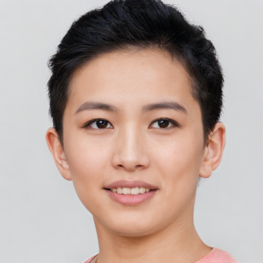 Joyful asian young-adult female with short  black hair and brown eyes