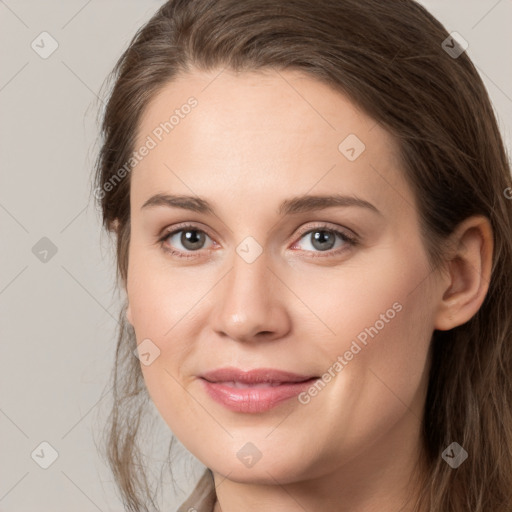 Joyful white young-adult female with long  brown hair and grey eyes