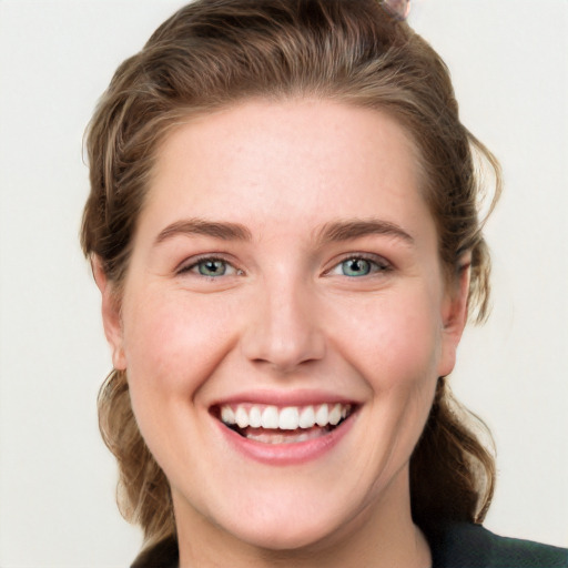 Joyful white young-adult female with medium  brown hair and blue eyes