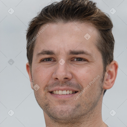 Joyful white young-adult male with short  brown hair and brown eyes