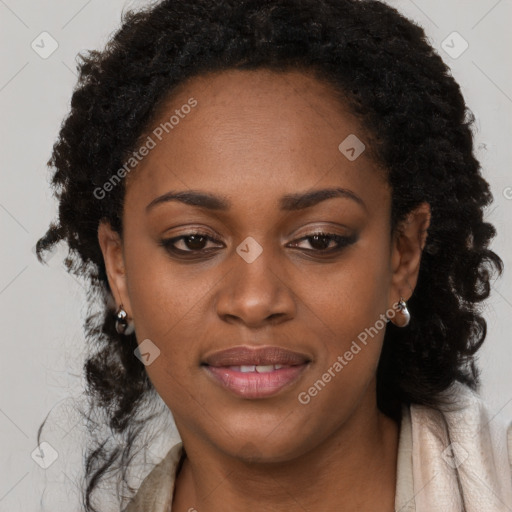 Joyful black young-adult female with long  brown hair and brown eyes