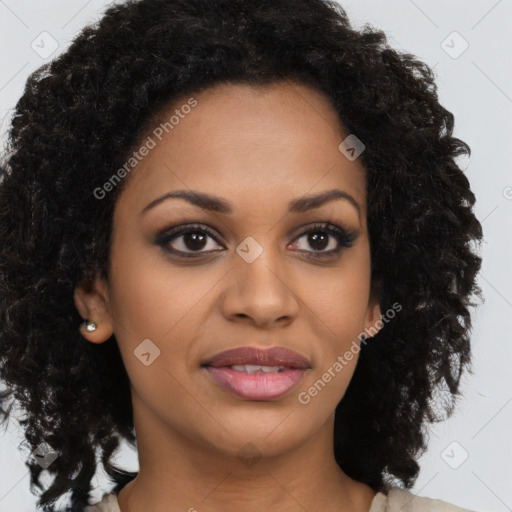 Joyful black young-adult female with long  brown hair and brown eyes