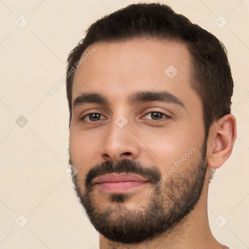 Neutral white young-adult male with short  black hair and brown eyes