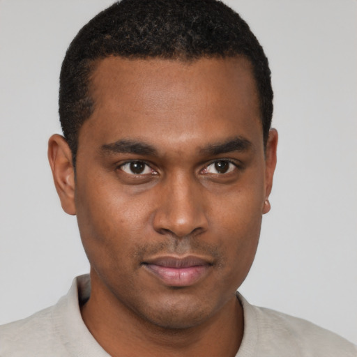 Neutral black young-adult male with short  black hair and brown eyes
