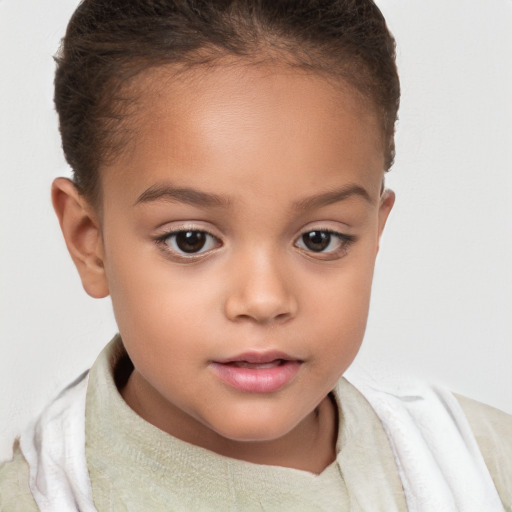 Joyful white child female with short  brown hair and brown eyes