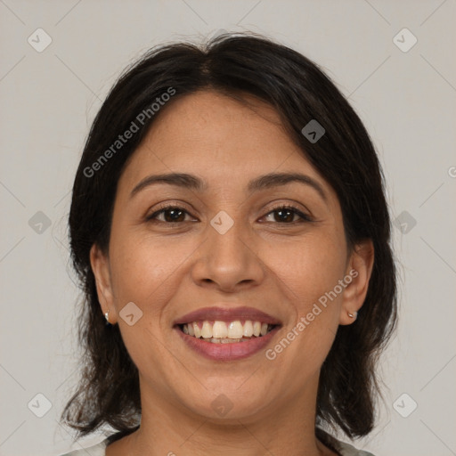 Joyful white adult female with medium  brown hair and brown eyes