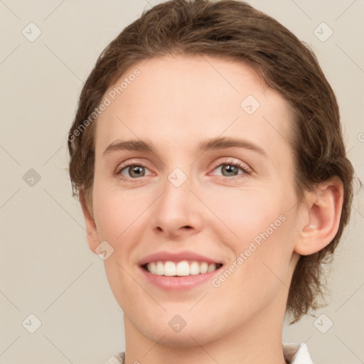 Joyful white young-adult female with medium  brown hair and green eyes