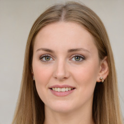 Joyful white young-adult female with long  brown hair and green eyes