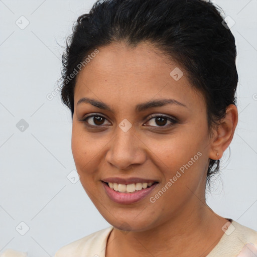 Joyful latino young-adult female with short  brown hair and brown eyes