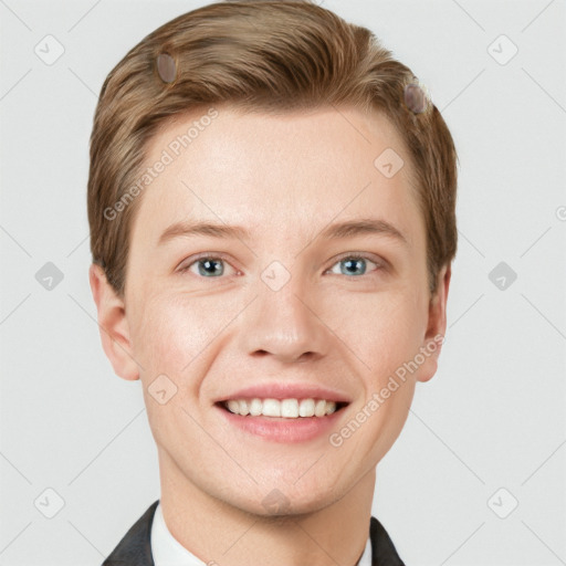 Joyful white young-adult male with short  brown hair and grey eyes